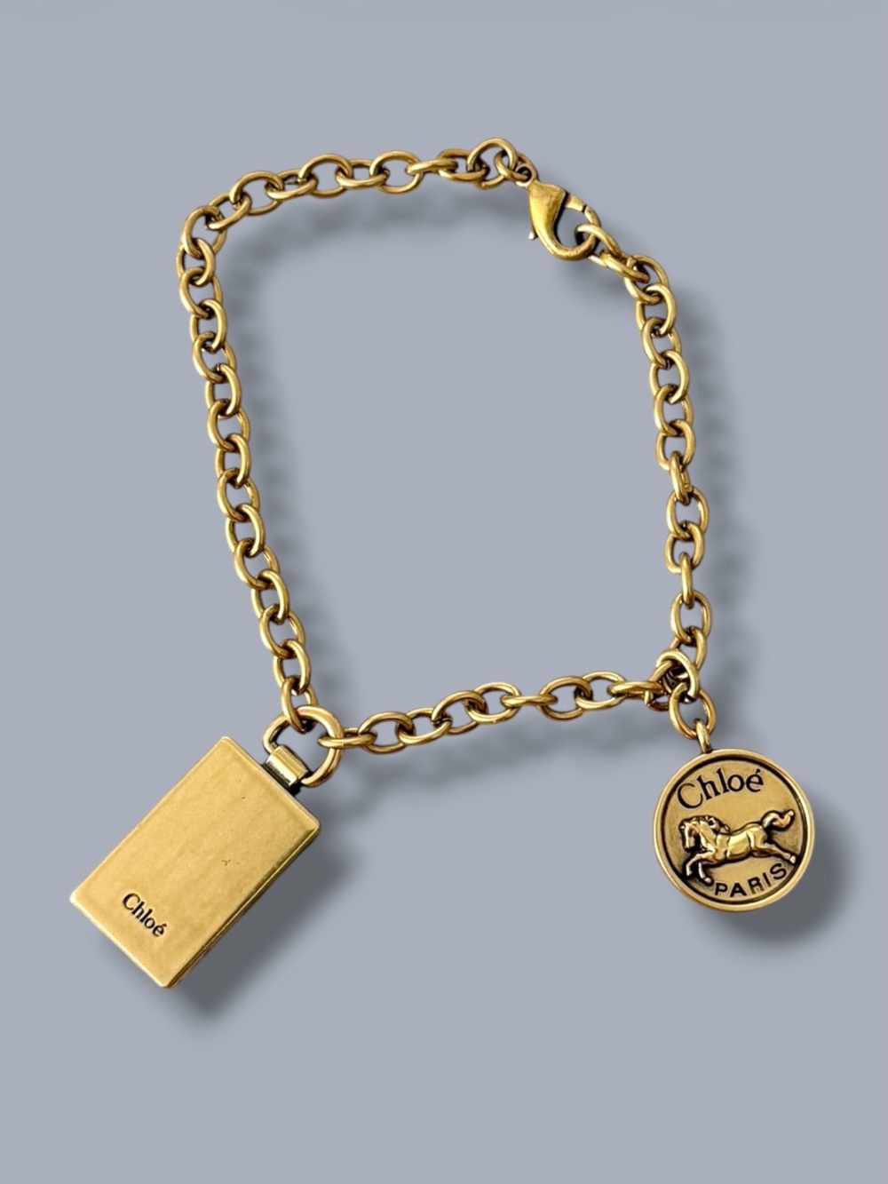 Authentic Used Chloe Horse medallion in vintage gold brass bag charm
